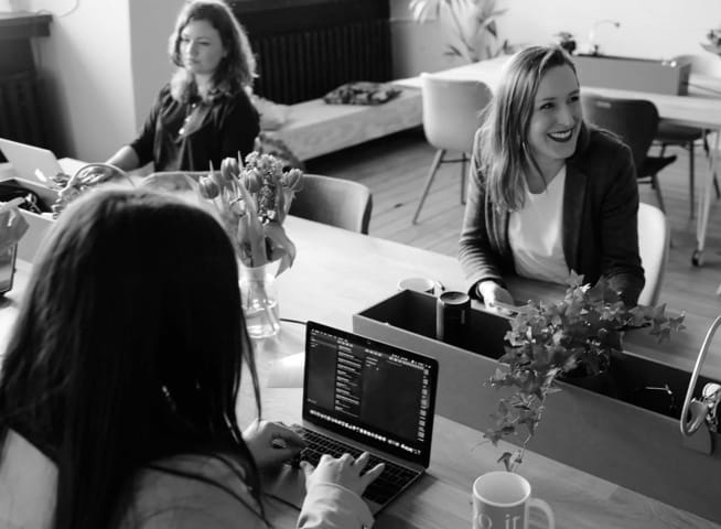 co-workers in office working happily